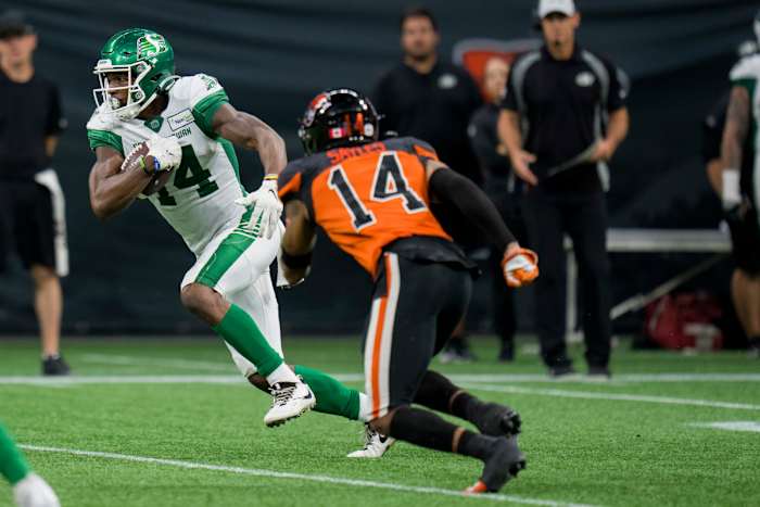Aug 26, 2022; Vancouver, British Columbia, CAN; Saskatchewan Roughriders wide receiver Tevin Jones (14) runs with the ball against the BC Lions in the second half at BC Place. Mandatory Credit: Bob Frid-USA TODAY Sports